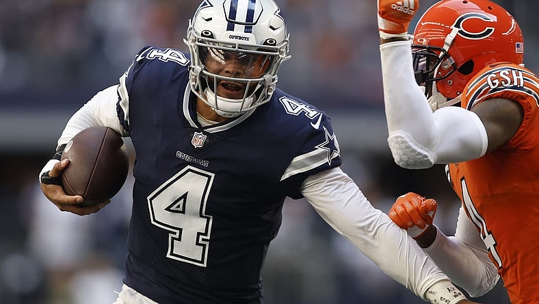Oct 30, 2022; Arlington, Texas, USA; Chicago Bears safety Eddie Jackson (4) runs the ball for a first down in the second quarter against the Chicago Bears at AT&T Stadium. Mandatory Credit: Tim Heitman-USA TODAY Sports