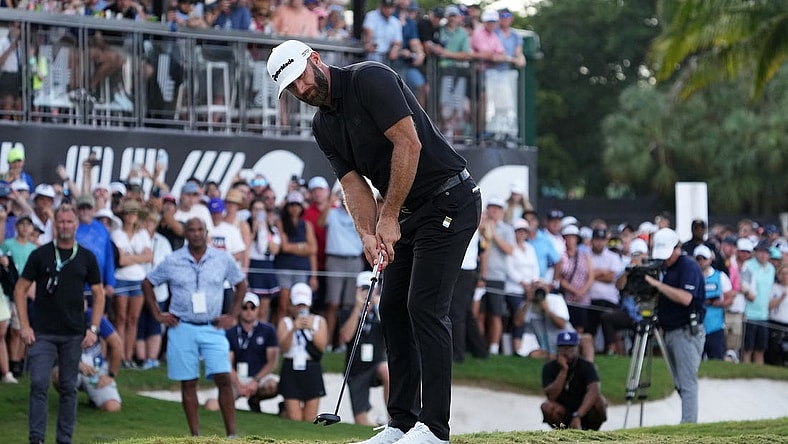 Oct 30, 2022; Miami, Florida, USA; Dustin Johnson putts on the 18th green during the final round of the season finale of the LIV Golf series at Trump National Doral. Mandatory Credit: Jasen Vinlove-USA TODAY Sports