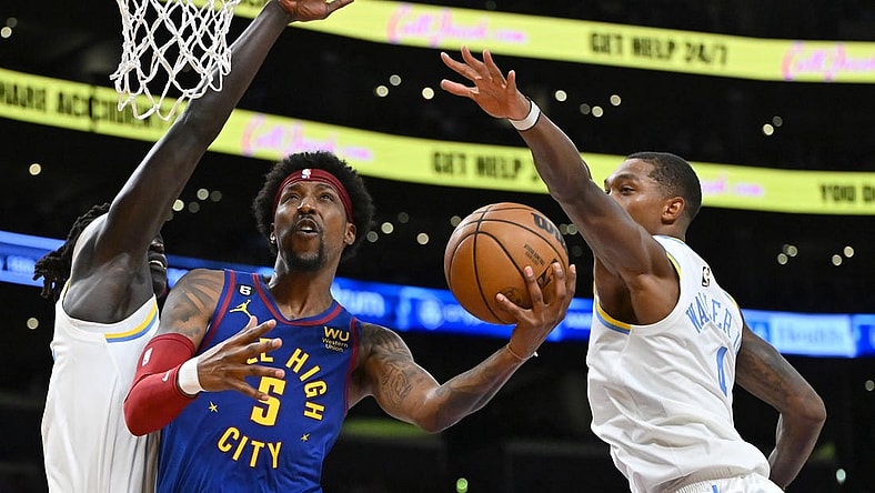 Oct 30, 2022; Los Angeles, California, USA; Denver Nuggets guard Kentavious Caldwell-Pope (5) is defended by Los Angeles Lakers forward Wenyen Gabriel (35) and Los Angeles Lakers guard Lonnie Walker IV (4) as he drives to the basket in the first half at Crypto.com Arena. Mandatory Credit: Jayne Kamin-Oncea-USA TODAY Sports