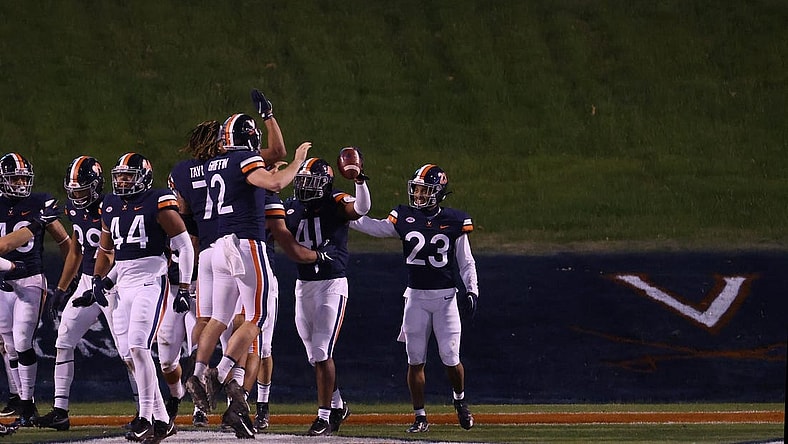 Nov 21, 2020; Charlottesville, Virginia, USA; Virginia Cavaliers linebacker D'Sean Perry (41) celebrates with teammates after returning an interception for a touchdown against the Abilene Christian Wildcats on the game's final play at Scott Stadium. Mandatory Credit: Geoff Burke-USA TODAY Sports