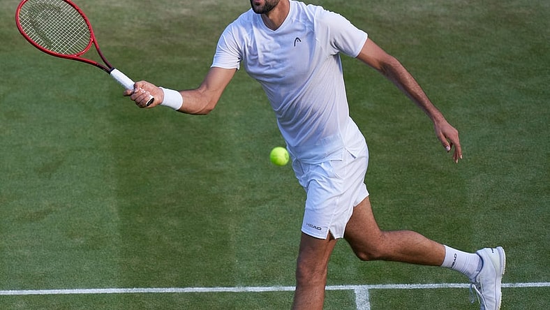 Jul 3, 2021; London, United Kingdom;  Marin Cilic (CRO) plays Daniil Medvedev (RUS)  on No 1 court in the men   s third round at All England Lawn Tennis and Croquet Club. Mandatory Credit: Peter van den Berg-USA TODAY Sports