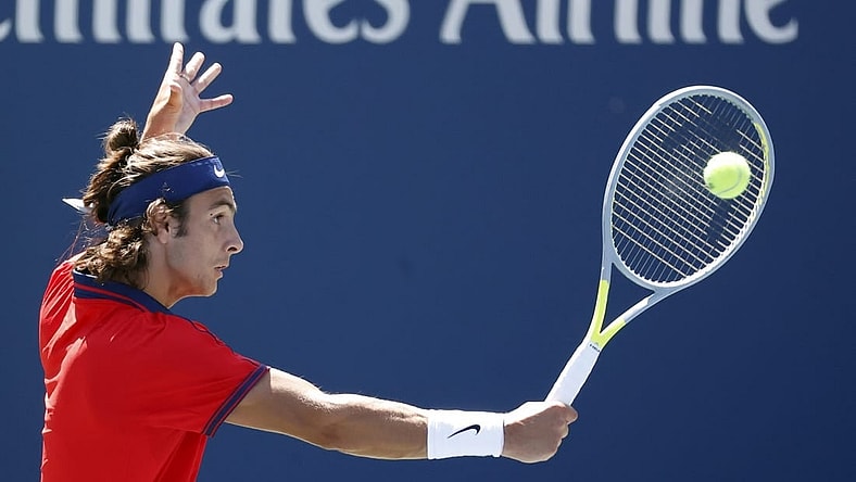 Sep 2, 2021; Flushing, NY, USA; Lorenzo Musetti of Italy hits a shot against Reilly Opelka of the United States in a second round match on day four of the 2021 U.S. Open tennis tournament at USTA Billie Jean King National Tennis Center. Mandatory Credit: Jerry Lai-USA TODAY Sports