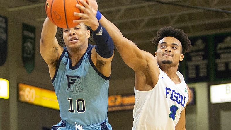 Rhode Island Rams guard Ishmael Leggett (10) grabs a rebound against Florida Gulf Coast Eagles guard Cyrus Largie (4) uring the second half of the NCAA men   s basketball game between the Rhode Island Rams and the Florida Gulf Coast Eagles, Tuesday, Nov. 23, 2021, at Alico Arena in Fort Myers, Fla. FGCU defeated Rhode Island 67-66.

Rhode Island at Florida Gulf Coast men's basketball