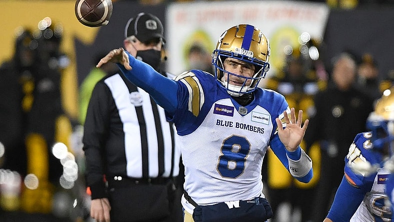 Dec 12, 2021; Hamilton, Ontario, CAN;   Winnipeg Blue Bombers quarterback Zach Collaros (8) throws a pass against Hamilton Tiger-Cats during the 108th Grey Cup football game at Tim Hortons Field. Mandatory Credit: Dan Hamilton-USA TODAY Sports