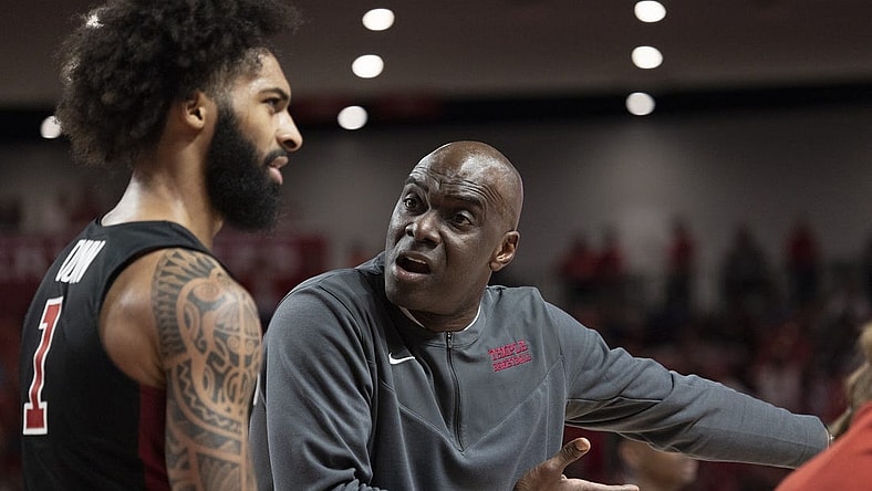 Mar 3, 2022; Houston, Texas, USA; Temple Owls head coach Aaron McKie talks to guard Damian Dunn (1) during a Houston Cougars time-out  in the first half at Fertitta Center. Mandatory Credit: Thomas Shea-USA TODAY Sports