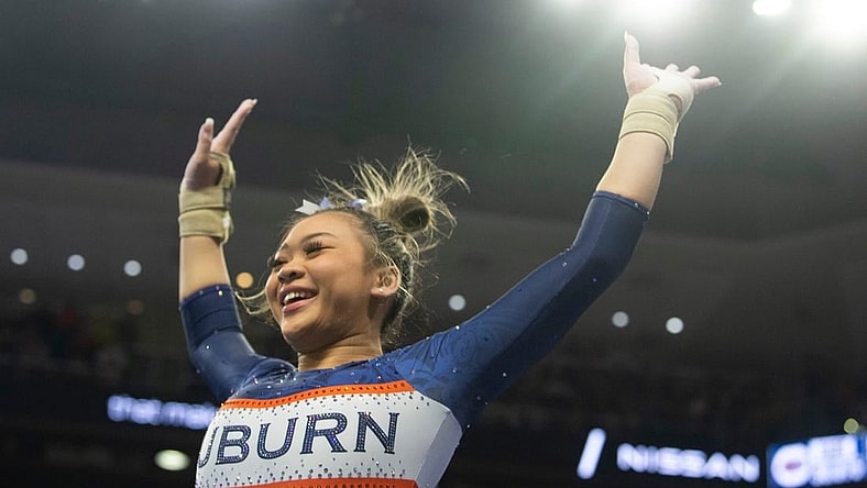 Auburn's Suni Lee reacts after her vault performance as Auburn Tigers gymnastics takes on Florida Gators at Neville Arena in Auburn, Ala., on Saturday, March 5, 2022. Auburn Tigers and Florida Gators ended in a tie at 198.575.