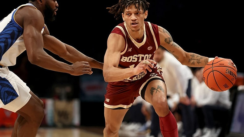 Mar 8, 2022; Brooklyn, NY, USA; Boston College Eagles guard Makai Ashton-Langford (11) controls the ball against Pittsburgh Panthers guard Onyebuchi Ezeakudo (31) during the second half at Barclays Center. Mandatory Credit: Brad Penner-USA TODAY Sports