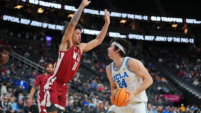 Mar 10, 2022; Las Vegas, NV, USA; Washington State Cougars forward DJ Rodman (11) defends against UCLA Bruins guard Jaime Jaquez Jr. (24) during the first half at T-Mobile Arena. Mandatory Credit: Stephen R. Sylvanie-USA TODAY Sports