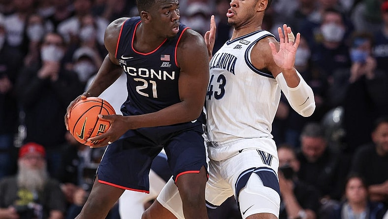 Mar 11, 2022; New York, NY, USA; Connecticut Huskies forward Adama Sanogo (21) controls the ball against Villanova Wildcats forward Eric Dixon (43) during the second half at Madison Square Garden. Mandatory Credit: Vincent Carchietta-USA TODAY Sports