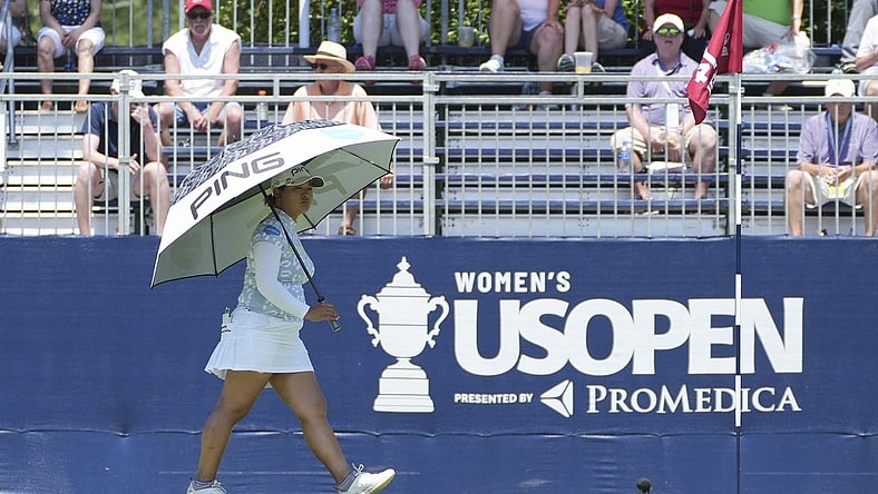 Jun 2, 2022; Southern Pines, North Carolina, USA; Ai Suzuki protects herself from the heat with an umbrella during the first round of the U.S. Women's Open. Mandatory Credit: David Yeazell-USA TODAY Sports