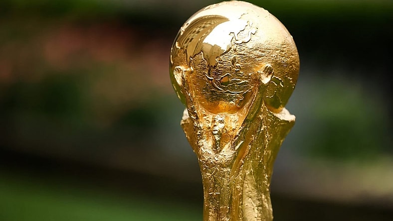 Jun 16, 2022; New York, New York, USA; A detail view of The FIFA World Cup Trophy sits on a stand outside of 30 Rockefeller Plaza.  Mandatory Credit: Jessica Alcheh-USA TODAY Sports