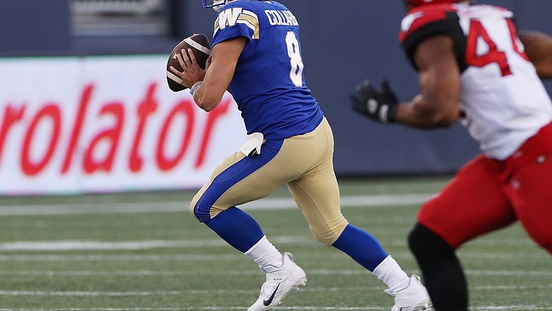 Aug 25, 2022; Winnipeg, Manitoba, CAN;  Winnipeg Blue Bombers quarterback Zach Collaros (8) looks for a receiver during the first half against the Calgary Stampeders at IG Field. Mandatory Credit: Bruce Fedyck-USA TODAY Sports