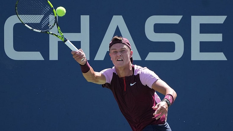 Aug 30, 2022; Flushing, NY, USA; Holger Rune of Denmark hits a shot against Peter Gojowczyk of Germany on day two of the 2022 U.S. Open tennis tournament at USTA Billie Jean King National Tennis Center. Mandatory Credit: Jerry Lai-USA TODAY Sports