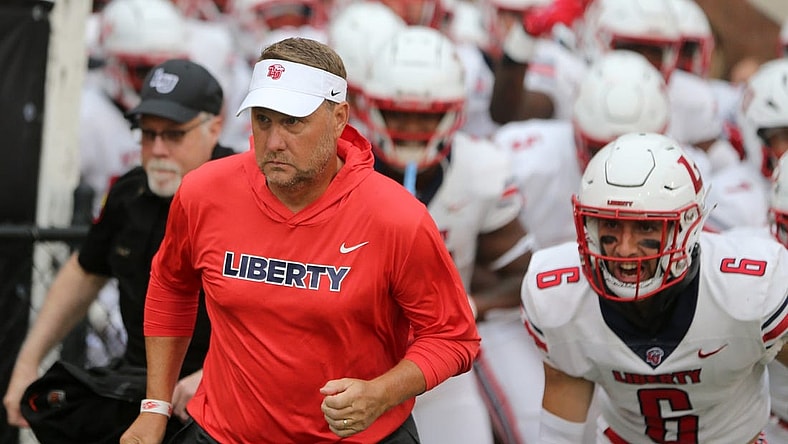 Sep 3, 2022; Hattiesburg, Mississippi, USA; Liberty Flames head coach Hugh Freeze run onto the field before their game against the Southern Miss Golden Eagles at M.M. Roberts Stadium. Mandatory Credit: Chuck Cook-USA TODAY Sports