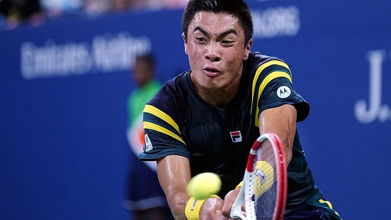 Sep 3, 2022; Flushing, NY, USA; Brandon Nakashima of the United States hits to Jannik Sinner of Italy on day six of the 2022 U.S. Open tennis tournament at USTA Billie Jean King Tennis Center. Mandatory Credit: Danielle Parhizkaran-USA TODAY Sports