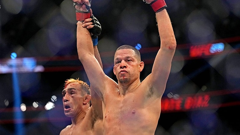 Sep 10, 2022; Las Vegas, Nevada, USA; Nate Diaz (red gloves) fights Tony Ferguson (blue gloves) during UFC 279 at T-Mobile Arena. Mandatory Credit: Joe Camporeale-USA TODAY Sports