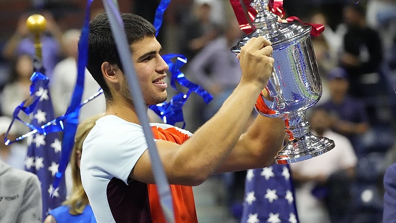 Sep 11, 2022; Flushing, NY, USA; Carlos Alcaraz (ESP) celebrates with the championship trophy after his match against Casper Ruud (NOR) (not pictured) in the men's singles final on day fourteen of the 2022 U.S. Open tennis tournament at USTA Billie Jean King Tennis Center. Mandatory Credit: Robert Deutsch-USA TODAY Sports