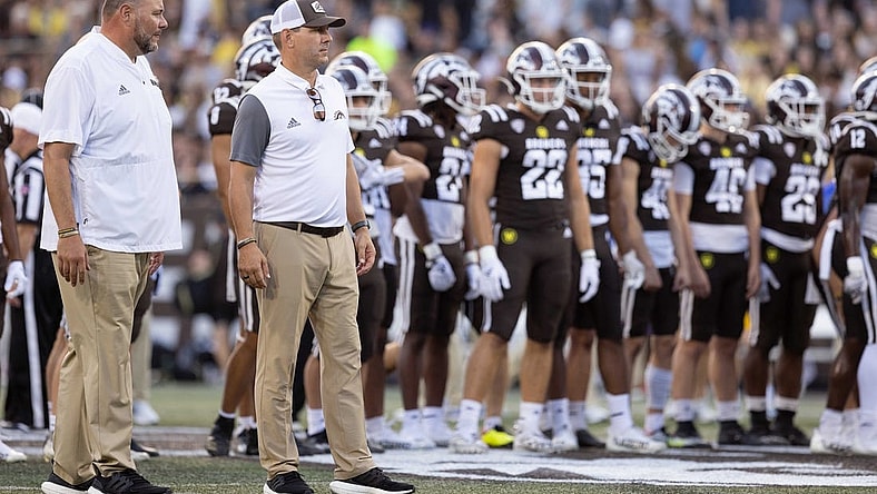 Sep 17, 2022; Kalamazoo, Michigan, USA; Western Michigan Broncos head coach Tim Lester (middle) and defensive coordinator Lou Esposito (left) watch pregame warm ups against Pittsburgh Panthers at Waldo Stadium. Mandatory Credit: Kimberly Moss-USA TODAY Sports