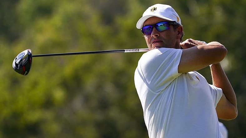 Sep 24, 2022; Charlotte, North Carolina, USA; International Team golfer Adam Scott hits his tee shot on the eighth hole during the four-ball match play of the Presidents Cup golf tournament at Quail Hollow Club. Mandatory Credit: Peter Casey-USA TODAY Sports