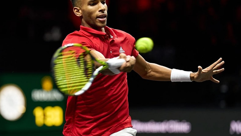 Sep 25, 2022; London, United Kingdom; Felix Auger-Aliassime (CAN) plays a shot against Novak Djokovic (SRB) in Lavers Cup singles. Mandatory Credit: Peter van den Berg-USA TODAY Sports
