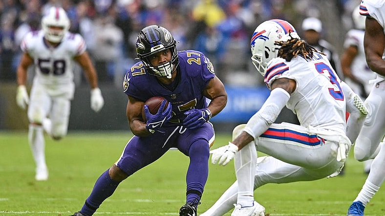 Oct 2, 2022; Baltimore, Maryland, USA;  Baltimore Ravens running back J.K. Dobbins (27) cuts in front of Buffalo Bills safety Damar Hamlin (3) during the second quarter at M&T Bank Stadium. Mandatory Credit: Tommy Gilligan-USA TODAY Sports
