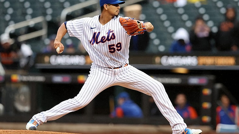 Oct 4, 2022; New York City, New York, USA; New York Mets starting pitcher Carlos Carrasco (59) pitches against the Washington Nationals during the first inning at Citi Field. Mandatory Credit: Brad Penner-USA TODAY Sports