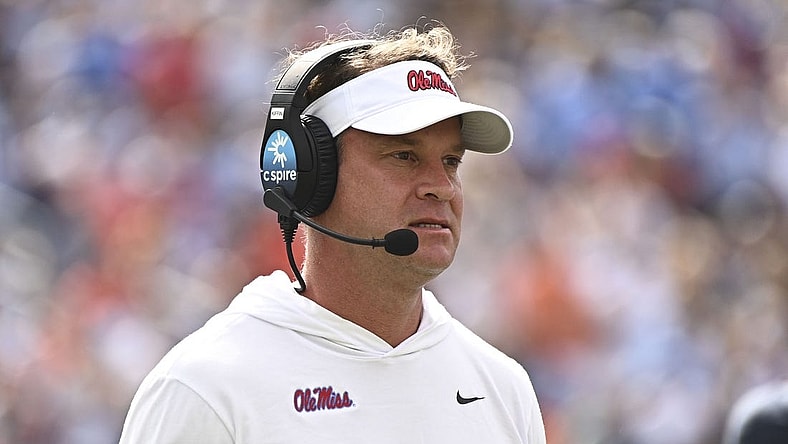 Oct 15, 2022; Oxford, Mississippi, USA; Mississippi Rebels head coach Lane Kiffin walks off the field during a timeout during the first quarter of the game against the Auburn Tigers at Vaught-Hemingway Stadium. Mandatory Credit: Matt Bush-USA TODAY Sports