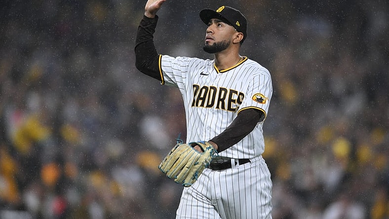 Oct 15, 2022; San Diego, California, USA;San Diego Padres relief pitcher Robert Suarez (75) celebrates a a strike out in the eighth inning against the Los Angeles Dodgers during game four of the NLDS for the 2022 MLB Playoffs at Petco Park. Mandatory Credit: Orlando Ramirez-USA TODAY Sports