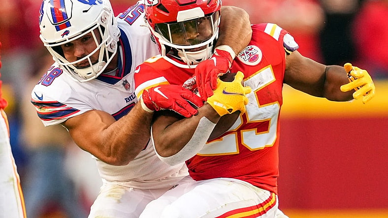 Oct 16, 2022; Kansas City, Missouri, USA; Kansas City Chiefs running back Clyde Edwards-Helaire (25) is tackled by Buffalo Bills linebacker Matt Milano (58) during the second half at GEHA Field at Arrowhead Stadium. Mandatory Credit: Jay Biggerstaff-USA TODAY Sports