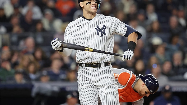 Oct 22, 2022; Bronx, New York, USA; New York Yankees right fielder Aaron Judge (99) reacts after striking out in the sixth inning against the Houston Astros during game three of the ALCS for the 2022 MLB Playoffs at Yankee Stadium. Mandatory Credit: Brad Penner-USA TODAY Sports