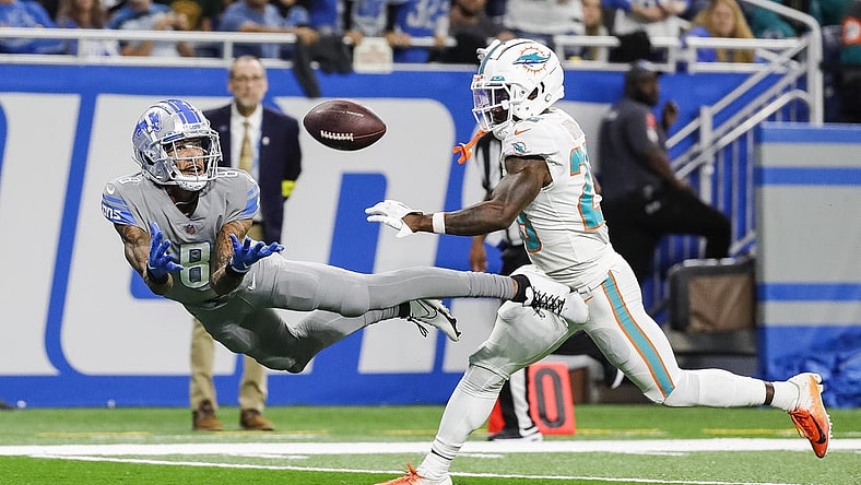 Oct 30, 2022; Detroit, Michigan, USA;  Detroit Lions wide receiver Josh Reynolds (8) tries to make a catch against Miami Dolphins cornerback Kader Kohou (28) during the second half at Ford Field. Mandatory Credit: Junfu Han-USA TODAY Sports