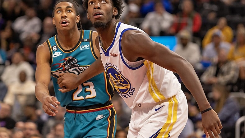 Oct 30, 2022; Detroit, Michigan, USA; Golden State Warriors center James Wiseman (33) blocks out Detroit Pistons guard Jaden Ivey (23) after a free throw during the second half at Little Caesars Arena. Mandatory Credit: David Reginek-USA TODAY Sports