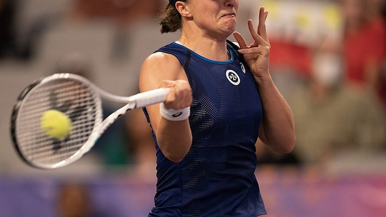 Nov 1, 2022; Forth Worth, TX, USA; Iga Swiatek (POL) returns a shot during her match against Daria Kasatkina on day two of the WTA Finals at Dickies Arena. Mandatory Credit: Susan Mullane-USA TODAY Sports