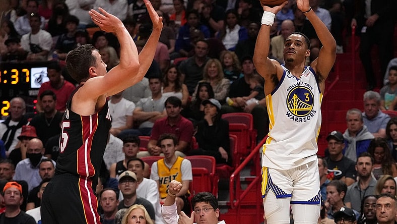 Nov 1, 2022; Miami, Florida, USA; Golden State Warriors guard Jordan Poole (3) attempts a three point shot on Miami Heat guard Duncan Robinson (55) during the first half at FTX Arena. Mandatory Credit: Jasen Vinlove-USA TODAY Sports