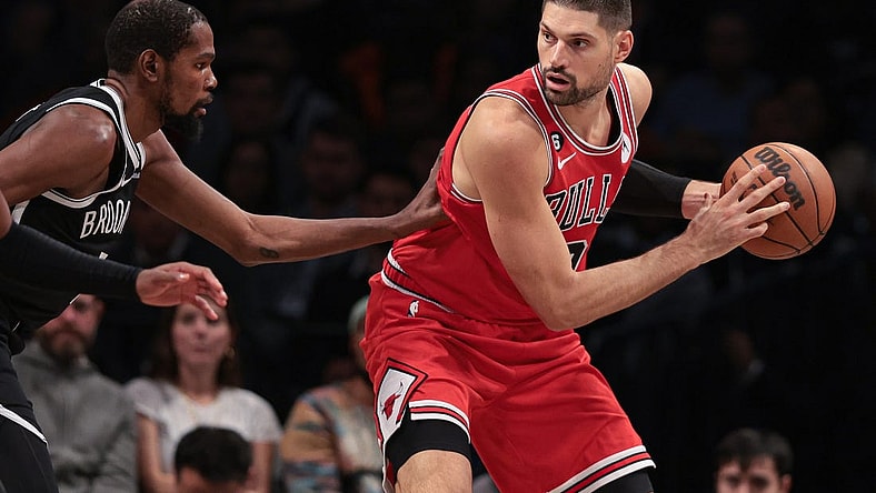 Nov 1, 2022; Brooklyn, New York, USA; Chicago Bulls center Nikola Vucevic (9) shields the ball from Brooklyn Nets forward Kevin Durant (7) during the first half at Barclays Center. Mandatory Credit: Vincent Carchietta-USA TODAY Sports