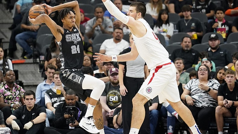 Nov 4, 2022; San Antonio, Texas, USA; San Antonio Spurs guard Devin Vassell (24) looks to the pass the ball while defended by Los Angeles Clippers center Ivica Zubac (40) at AT&T Center. Mandatory Credit: Scott Wachter-USA TODAY Sports