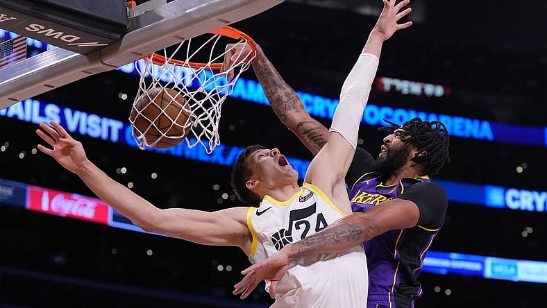 Nov 4, 2022; Los Angeles, California, USA; Los Angeles Lakers forward Anthony Davis (3) dunks the ball against Utah Jazz center Walker Kessler (24) in the first half at Crypto.com Arena. Mandatory Credit: Kirby Lee-USA TODAY Sports