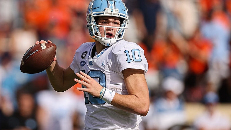 Nov 5, 2022; Charlottesville, Virginia, USA; North Carolina Tar Heels quarterback Drake Maye (10) attempts a pass against the Virginia Cavaliers during the second half at Scott Stadium. Mandatory Credit: Scott Taetsch-USA TODAY Sports