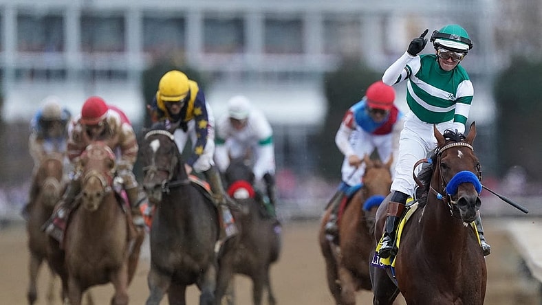 Jockey Flavien Prat celebrates aboard Flightline after winning the Breeders' Cup Classic at Keeneland. Nov. 5, 2022

Race 11 Flightline