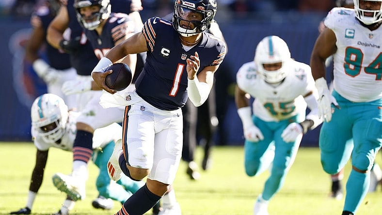 Nov 6, 2022; Chicago, Illinois, USA; Chicago Bears quarterback Justin Fields (1) rushes the ball for a touchdown against the Miami Dolphins during the second half at Soldier Field. Mandatory Credit: Mike Dinovo-USA TODAY Sports