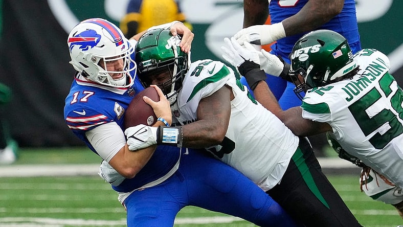 Nov 6, 2022; East Rutherford, NJ, USA; New York Jets defensive end Vinny Curry (99) tackles Buffalo Bills quarterback Josh Allen (17) in the second half at MetLife Stadium. Mandatory Credit: Robert Deutsch-USA TODAY Sports