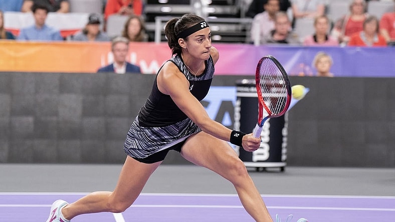 Nov 6, 2022; Forth Worth, TX, USA; Caroline Garcia (FRA) returns a shot during her match against Maria Sakkari (GRE) on day seven of the WTA Finals at Dickies Arena. Mandatory Credit: Susan Mullane-USA TODAY Sports