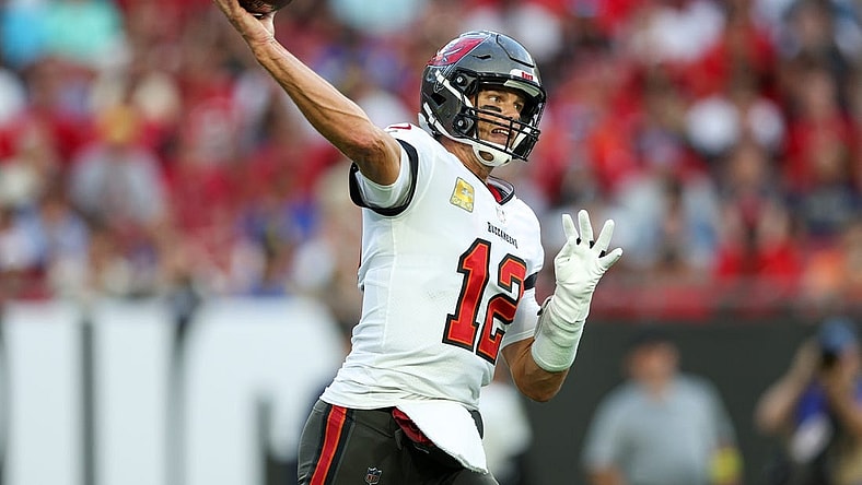 Nov 6, 2022; Tampa, Florida, USA;  Tampa Bay Buccaneers quarterback Tom Brady (12) drops back to pass against the Los Angeles Rams in the first quarter at Raymond James Stadium. Mandatory Credit: Nathan Ray Seebeck-USA TODAY Sports