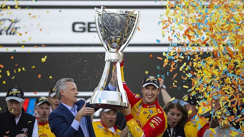 Nov 6, 2022; Avondale, Arizona, USA; NASCAR Cup Series driver Joey Logano celebrates after winning the Cup Championship at Phoenix Raceway. Mandatory Credit: Mark J. Rebilas-USA TODAY Sports