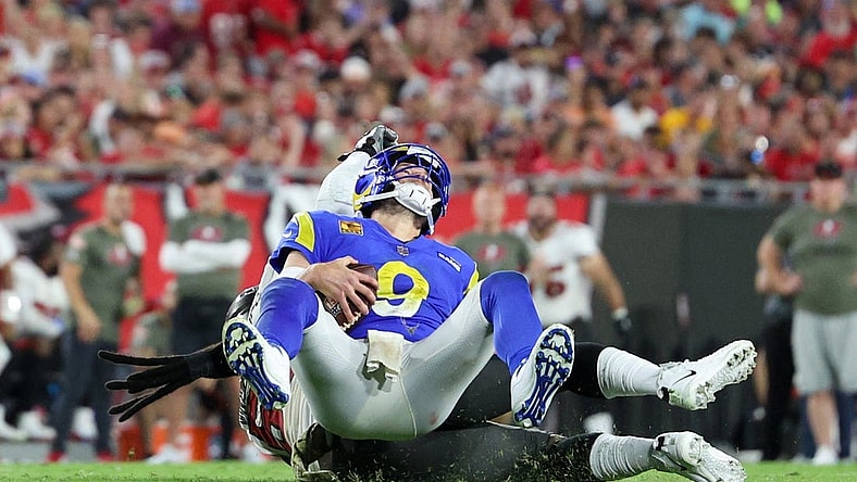 Nov 6, 2022; Tampa, Florida, USA;  Los Angeles Rams quarterback Matthew Stafford (9) is sacked by Tampa Bay Buccaneers defensive tackle Rakeem Nunez-Roches (56) in the third quarter at Raymond James Stadium. Mandatory Credit: Nathan Ray Seebeck-USA TODAY Sports