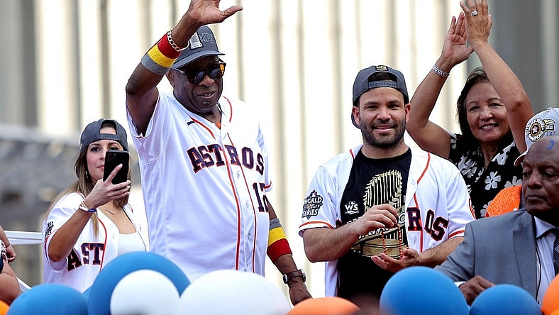 Nov 7, 2022; Houston, Texas, USA; Houston Astros manager Dusty Baker Jr. (12, left) and Houston Astros second baseman Jose Altuve (27) both wave to the crowd atop a parade vehicle during the Houston Astros Championship Parade in Houston, TX. Mandatory Credit: Erik Williams-USA TODAY Sports