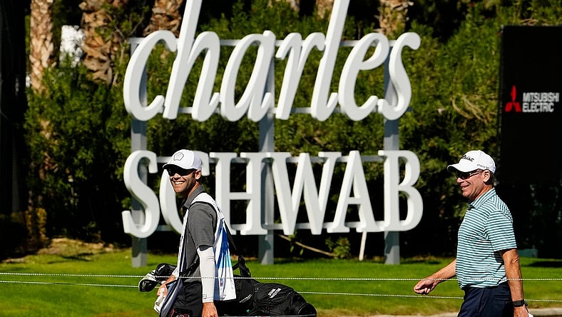 Nov 10, 2022; Phoenix, AZ, USA; John Huston (right) walks off the 18th hole smiling after shooting 6-under-par during round one of the Charles Schwab Cup at Phoenix Country Club. Mandatory Credit: Rob Schumacher-USA TODAY Sports