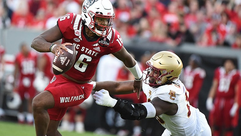 Nov 12, 2022; Raleigh, North Carolina, USA;North Carolina State Wolfpack quarterback MJ Morris (16) scrambles during the first half against the Boston College Eagles at Carter-Finley Stadium. Mandatory Credit: Rob Kinnan-USA TODAY Sports