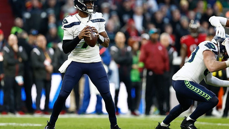 Nov 13, 2022; Munich, Germany, DEU; Seattle Seahawks quarterback Geno Smith (7) looks to pass against the Tampa Bay Buccaneers during the second quarter of an International Series game at Allianz Arena. Mandatory Credit: Douglas DeFelice-USA TODAY Sports