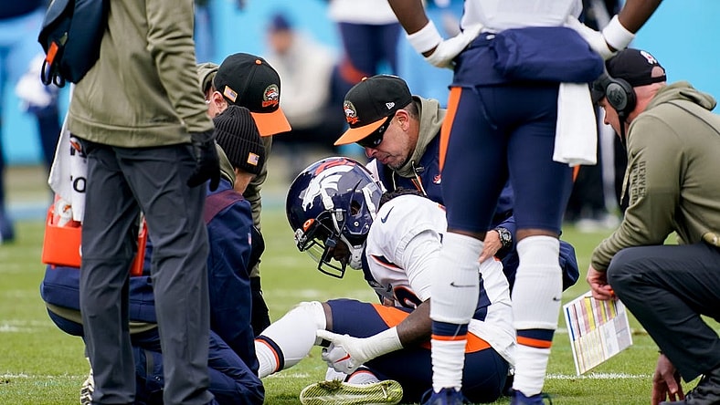 Nov 13, 2022; Nashville, Tennessee, USA; Denver Broncos wide receiver Jerry Jeudy (10) is checked by trainers after getting injured in the first quarter at Nissan Stadium. Mandatory Credit: Andrew Nelles-USA TODAY Sports